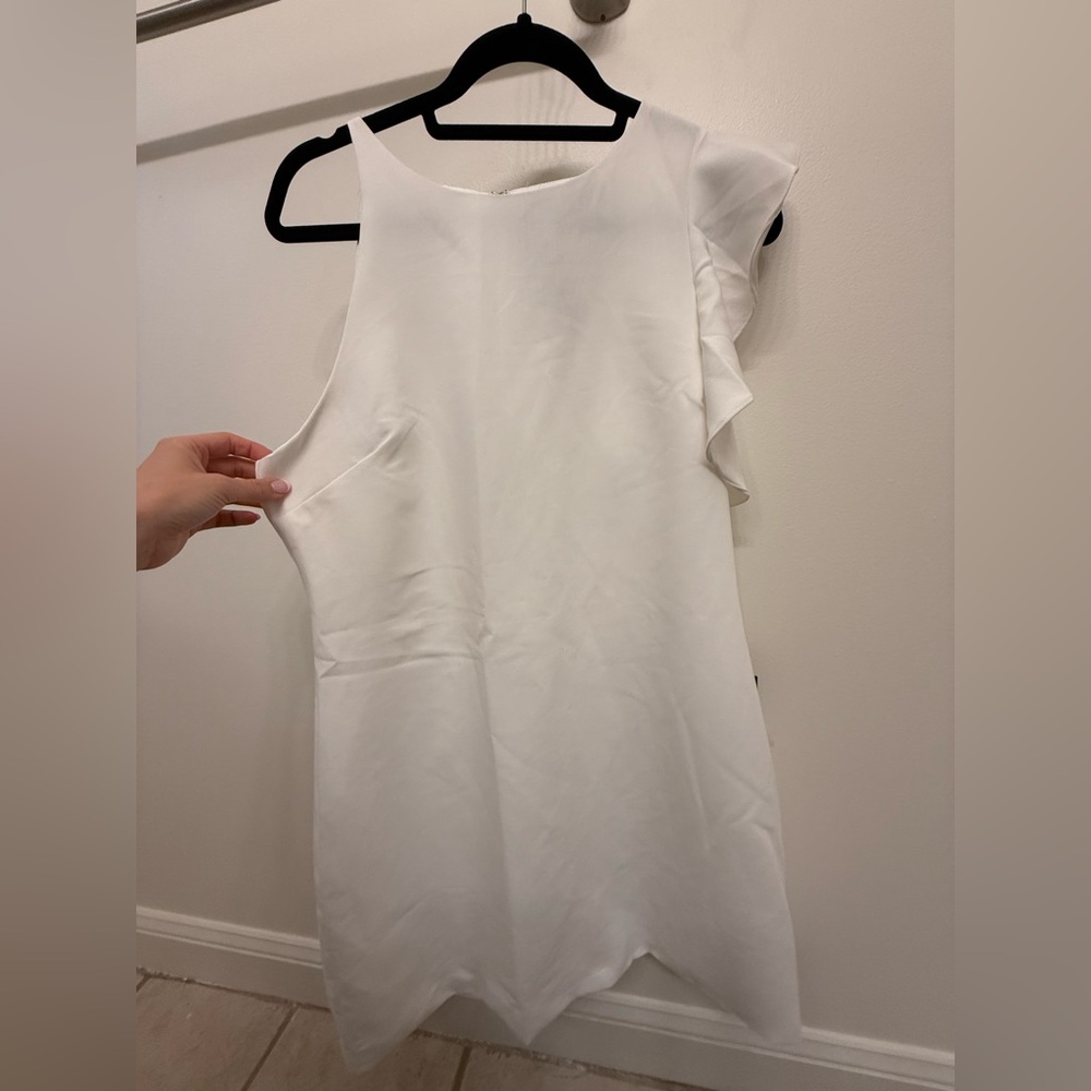 White Sleeveless Dress with Shoulder Ruffle